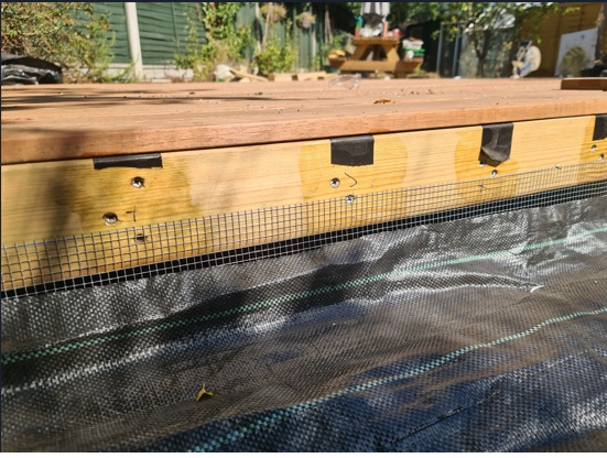 Mesh weld rodent barrier installed around base