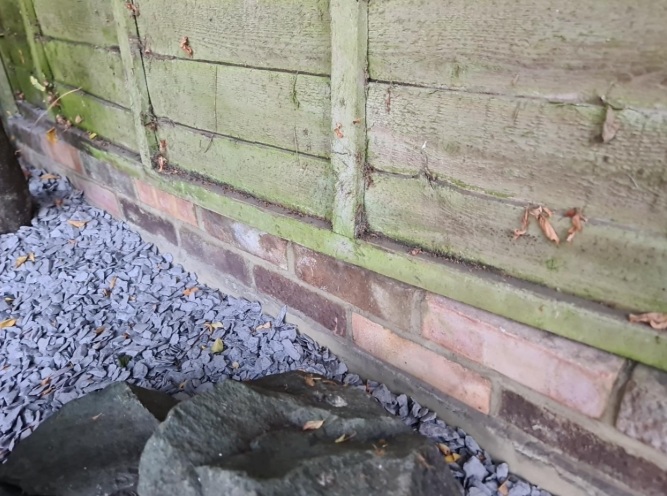 Bricks laid as gravel board