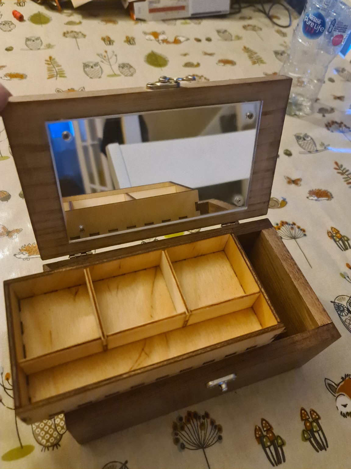 Open jewellery box showing mirror and tray inserts